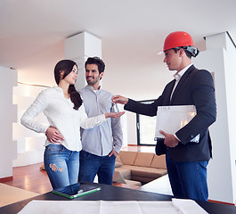 Image showing couple buying new home with real estate agent