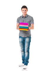 Image showing Young student carrying books