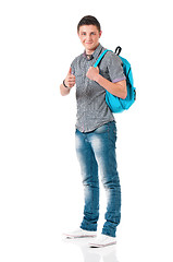 Image showing Student boy showing thumb sign with backpack
