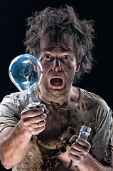 Image showing Burnt man with light bulb