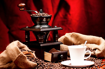 Image showing Coffee grinder and cup