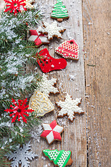 Image showing Christmas cookies, decorations and spruce branches.