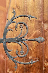 Image showing medieval metal decorations on old door