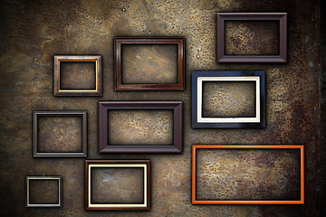 Image showing picture frames on abstract rusty wall