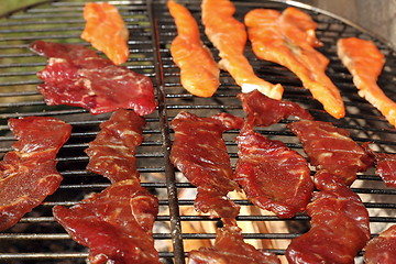 Image showing beef and salmon left to smoke