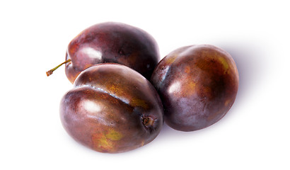 Image showing Three violet plums