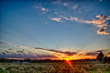 Image showing sun setting over country farm land in york south carolina