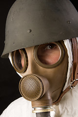 Image showing woman in gas mask and helmet
