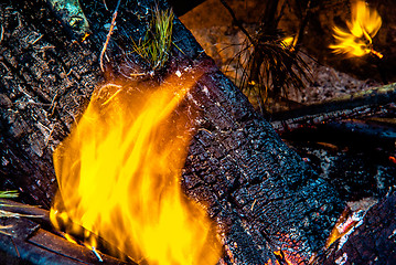 Image showing camp fire flames burning at night after hike