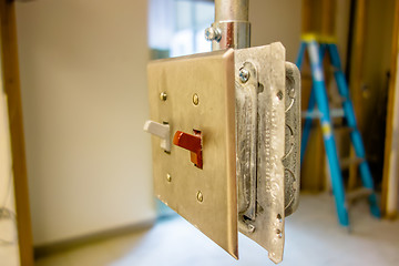 Image showing light switch ready to get enclosed into wall during construction