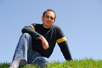 Image showing Man sitting on grass
