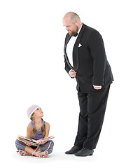 Image showing Little Girl and Servant in Tuxedo Looking at Each Other