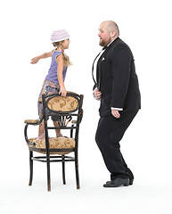 Image showing Little Girl and Servant in Tuxedo Have Fun