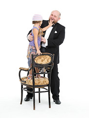 Image showing Little Girl and Servant in Tuxedo Have Fun