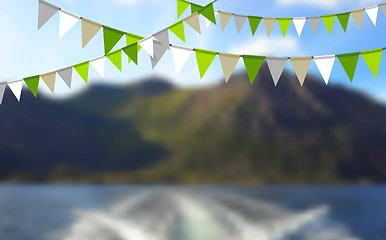 Image showing Party flags celebrate abstract background and mountain landscape