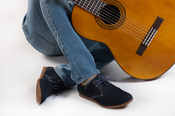 Image showing Man\'s Legs And Guitar