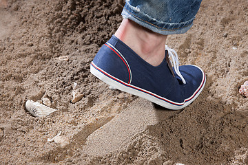 Image showing Man\'s Legs And Footprint On The Sand