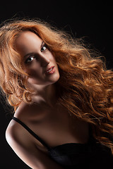 Image showing Young Red- Haired Woman In Black Lingerie