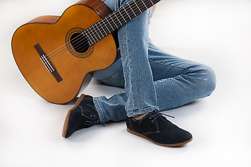 Image showing Man\'s Legs And Guitar