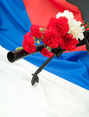 Image showing Machinegun And Flowers