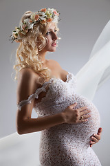 Image showing Young Pregnant Woman With Flower Garland