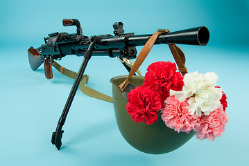 Image showing Machine Gun And Flowers