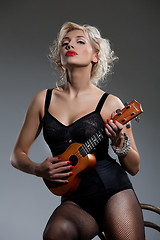 Image showing Young Woman With Ukulele