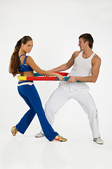 Image showing Young Woman And Man With Training Device