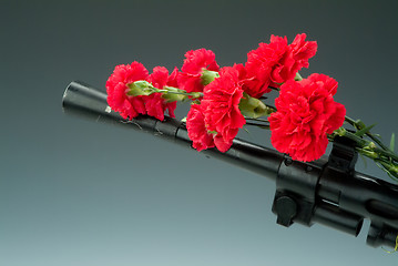 Image showing Machinegun And Flowers