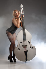 Image showing Young Woman In Lingerie With A Double Bass