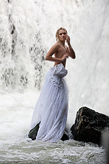 Image showing Young Topless Woman In A River