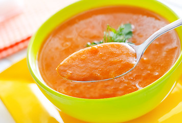 Image showing Fresh soup from pumpkin in the green bowl