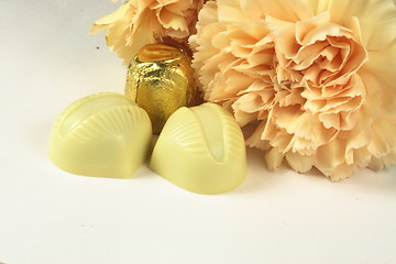 Image showing chocolates and carnations