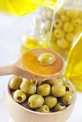 Image showing green olives and oil