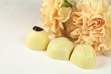 Image showing chocolates and carnations