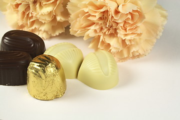 Image showing chocolates and carnations