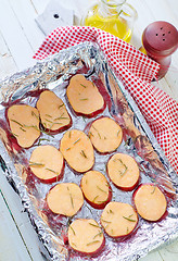 Image showing sweet potato with rosemary on the foil