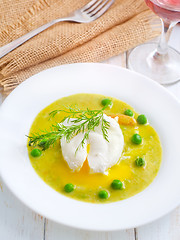 Image showing Fresh soup from green peas and egg-poached