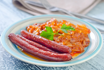 Image showing sausages with fried cabbage