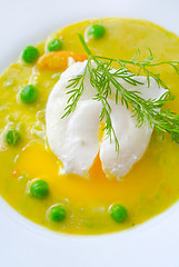 Image showing Fresh soup from green peas and egg-poached