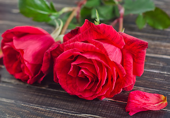 Image showing rose on wooden background