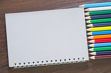 Image showing color pencils and note