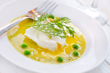 Image showing Fresh soup from green peas and egg-poached