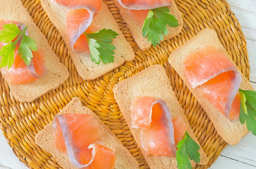 Image showing toasts with salmon and parsley