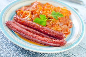 Image showing sausages with fried cabbage