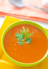 Image showing Fresh soup from pumpkin in the green bowl