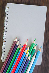 Image showing color pencils and note