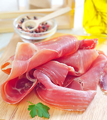 Image showing Proscuitto on a wooden board