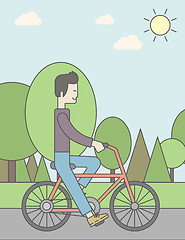 Image showing Asian man riding bicycle in park.