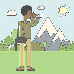 Image showing Photographer taking photo in mountains